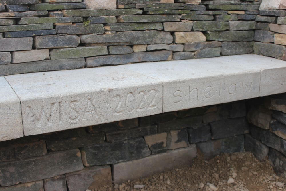 WISA Carved into the stone bench